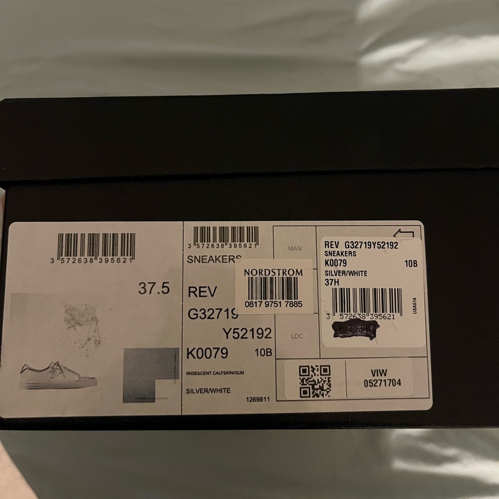 White low top Chanel sneakers